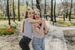 © irissca - Friendship day. Lifestyle image of best friend girls in spring summer city street. Two Teenage girls having fun in the  park