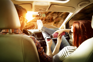 Wall Mural - Autumn car trip and two young people 