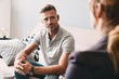 © Drobot Dean - Photo of confident focused man having conversation with psychologist in room