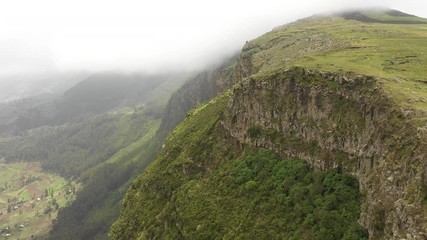 Wall Mural - scenic drone flight over rugged mountain cliffs on high altitude plateau in northern ethiopia
