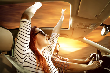 Poster - Young two people in car and autumn trip. Free space for your decoration and sunset time. 