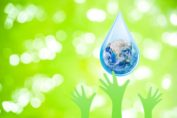 Wall Mural - World Water Day Concept : Blue planet earth globe in water drop falling to many green hands. (Elements of this image furnished by NASA.)