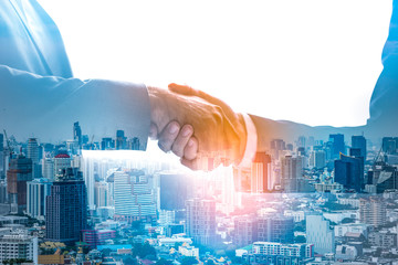 Double exposure worker hand shake teamwork brainstorming with innovation business. concept success investment.Business People Handshake Greeting Deal Concept.