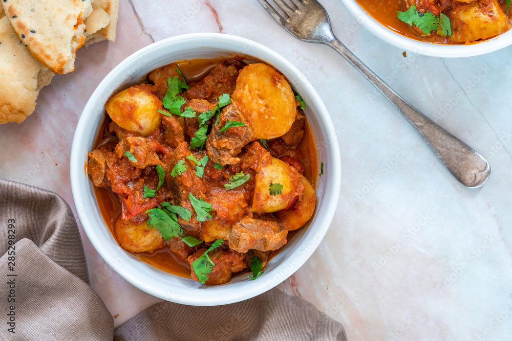 Aloo gosht with naan bread - lamb and potato curry - cuisine popular in Pakistan, Bangladesh and North India - obrazy, fototapety, plakaty 