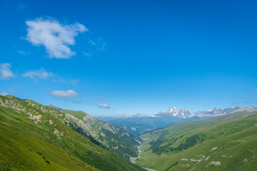 Svaneti landscape with glacier and snow-capped mountain in the back near Mestia village in Svaneti region, Georgia.