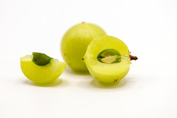 Wall Mural - Phyllanthus emblica or Indian gooseberry fruits isolate on white background.Also known as emblic,emblic myrobalan,myrobalan.