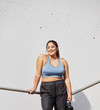 © W2 Photography/Stocksy - Healthy athletic real size woman in sport workout clothing.
