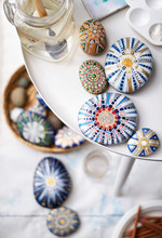 Close-up Of Mandala Painted Stones. Painting Scene At Home, Empty Scene.