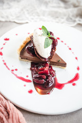 Wall Mural - Chocolate Custard Tart Dessert with Concord Grape Compote and Vanilla Chantilly Cream