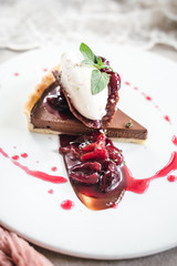 Wall Mural - Chocolate Custard Tart Dessert with Concord Grape Compote and Vanilla Chantilly Cream