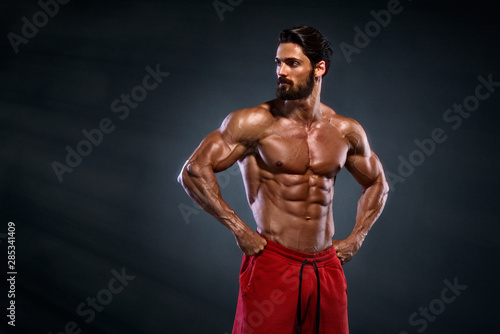 Cuadros en Lienzo Handsome Muscular Men Posing and Flexing Muscles