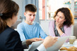 © JackF - Teenager and his mother listening college tutor