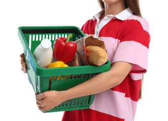 Wall Mural - Young woman with shopping basket isolated on white, closeup