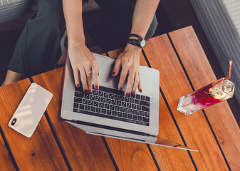 Pretty Young Beauty Woman Using Laptop in cafe, outdoor portrait business woman, hipster style, internet, smartphone, office, Bali Indonesia, holding, mac OS, manager, freelancer 