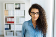 © contrastwerkstatt - Serious attentive businesswoman staring at camera