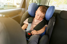 Sleeping Baby Boy Buckled In Car Seat