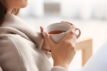 Beautiful Young Woman Drinking Tea At Home, Closeup