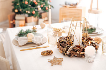 Beautiful table setting with Christmas decorations in living room