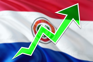 Paraguay economy graph is indicating positive growth, green arrow going up with trend line. Business concept on national background.