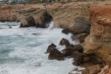 Rocky shore of Cyprus with waves crashing