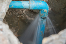 Leaking Water From Blue Pipe From Underground