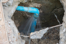 Leaking Water From Blue Pipe From Underground