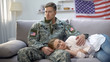 Upset american soldier stroking girlfriend sleeping on sofa, military service