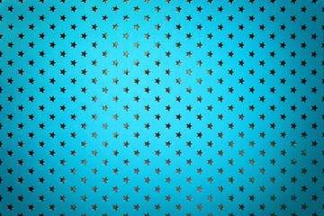 Blue background from metal foil paper with a silver stars pattern