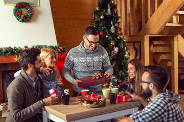 Canvas Print - Friends exchanging Christmas presents