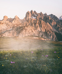 dramatic foggy sunset in the dolomites mountains, south tyrol, italy.  Beautiful scenery and travel destination located in the tre cime di lavaredo national park.