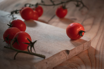 cherry tomatoes on a wooden cutting board