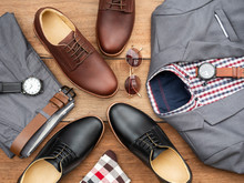 Men Fashion Casual Clothing Set And Accessories Isolated On Wooden Background Include Derby Shoes, Gray Suit, Pants, Belt, Sunglass, Sock And Scottis Office Shirt. Flat Lay, Top View