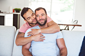 Wall Mural - Portrait of a Cute Male gay homosexual Couple at Home