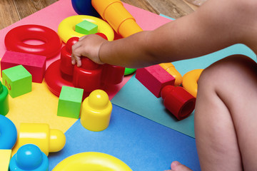Wall Mural - child kid playing colorful education toys pattern background on the bright background. Childhood infancy children babies concept.