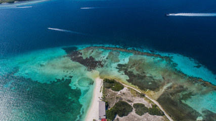 Caribbean: Vacation in the blue sea and deserted islands. Aerial view of a blue sea with crystal water. Great landscape. Beach scene. Aerial View Island Landscape Los Roques