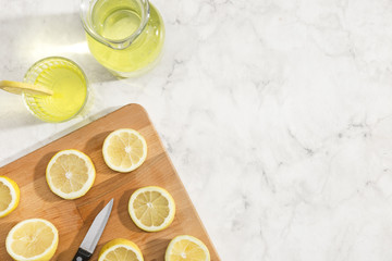 Sliced lemons on wooden board top view