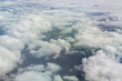 White clouds above green land aerial view