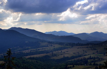  silhouettes of mountains in the evening
