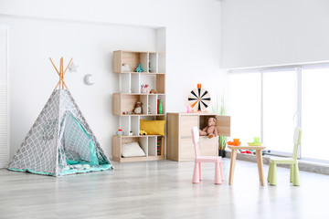 Interior of modern children's room with toys