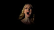 Young woman screaming in dark room, sense of despair, stress and life problems