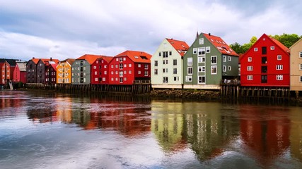 Wall Mural - Trondheim, Norway. City center of Trondheim, Norway during the cloudy summer day. Time-lapse of historical colorful building and grey cloudy sky, zoom