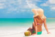 © el.rudakova - Young woman in pink swimsuit with coconut cocktail on the beach, bali