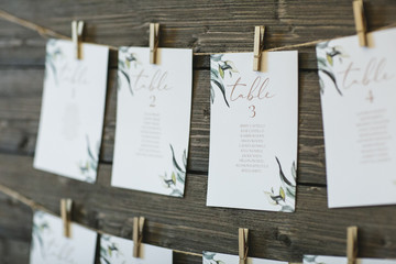 table place cards hanging on wall