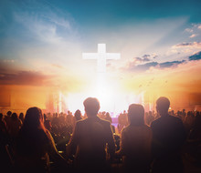 Worship Concept: Group Of People Holding Hands Praying Worship At Sunset Background