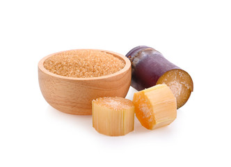 Wall Mural - sugar cane and brown sugar on white background