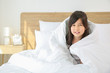 © Pixel-Shot - Little girl sitting in bed at home