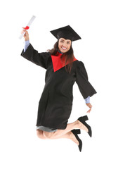 Wall Mural - Jumping female graduate with diploma on white background