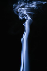 Blue wavy smoke on black background