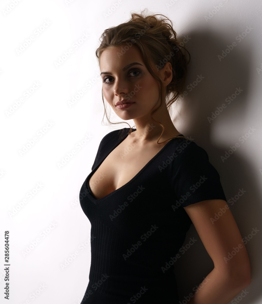 Attractive young model in black skin-tight dress Stock Photo | Adobe Stock Attractive young model in black skin-tight dress Stock Photo | Adobe Stock