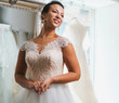 © Nejron Photo - Beautifu bride choosing wedding dress in a wedding salon